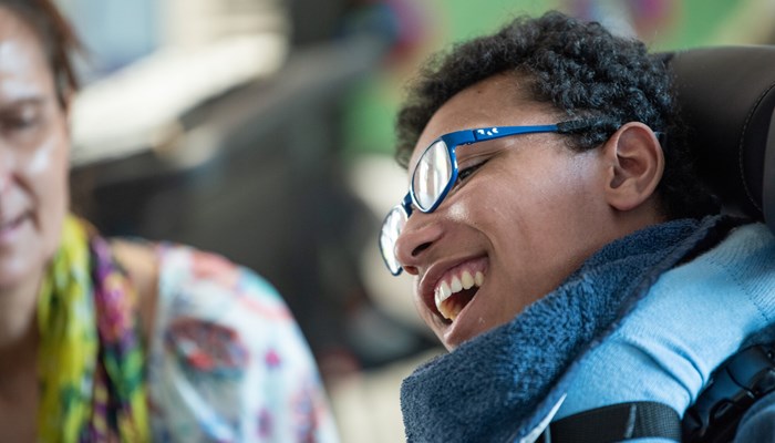 Teenage boy smiling during a visit to our Kent Hospice