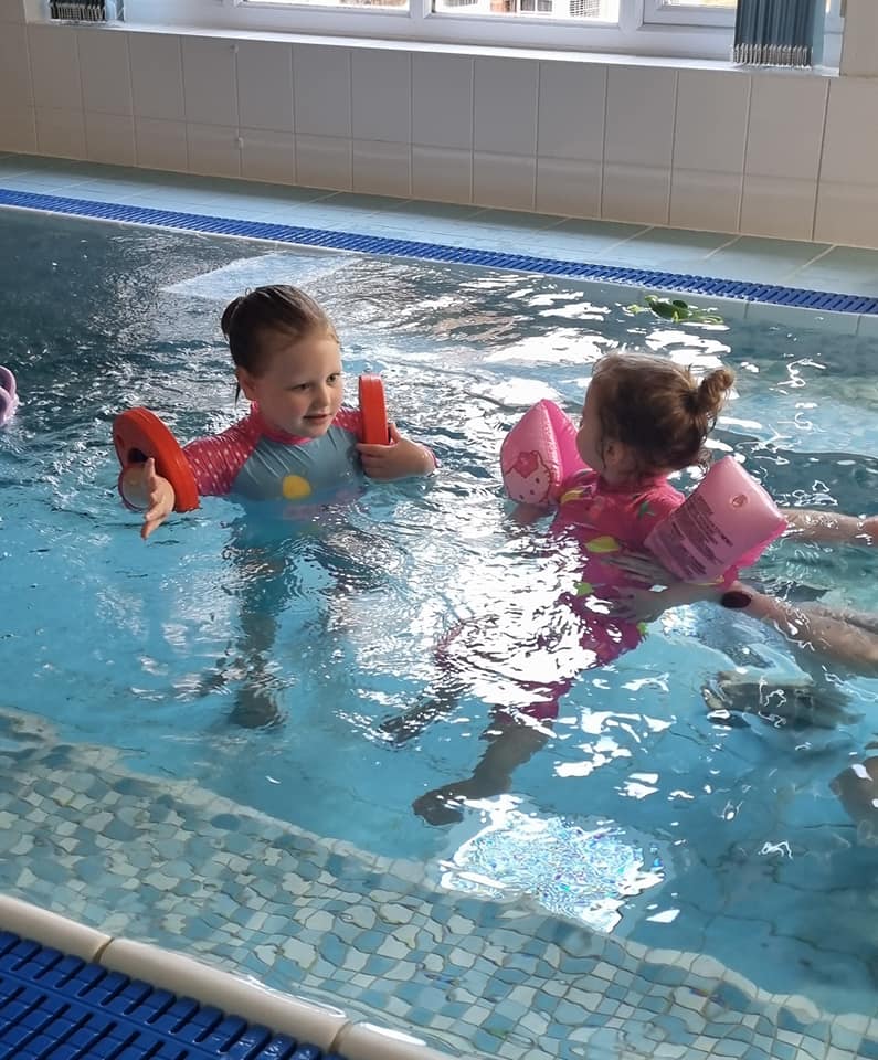 Two girls using the hydro pool at Demelza Kent.