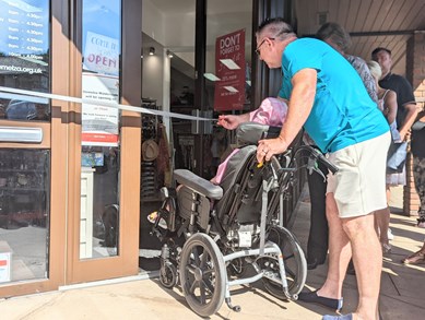 Isabella, eight, cutting the ribbon at our new Walderslade Shop with her family