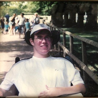 Young lad sitting in a wheelchair