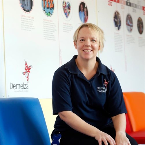 Demelza Nurse sitting on a chair smiling